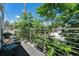 Cozy balcony with a table, chair and lush greenery, offering a peaceful retreat at 2103 W 32Nd Ave # 10, Denver, CO 80211