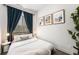 Inviting bedroom with dark curtains, minimalist decor, and a comfortable bed, creating a serene atmosphere at 2103 W 32Nd Ave # 10, Denver, CO 80211