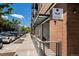 Modern building exterior with outdoor seating and prominent signage at 2103 W 32Nd Ave # 10, Denver, CO 80211