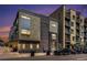 Modern exterior showcasing clean lines, a balcony, and convenient parking at 2103 W 32Nd Ave # 10, Denver, CO 80211