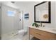 Modern bathroom with walk-in shower, marble countertop, and stylish fixtures at 2434 Mapleton Ave, Boulder, CO 80304