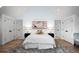Bedroom showcasing hardwood floors, ensuite bath, and a sitting area at 2434 Mapleton Ave, Boulder, CO 80304