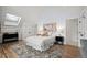 Bright bedroom with skylight, hardwood floors, and ensuite bath at 2434 Mapleton Ave, Boulder, CO 80304