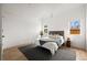 Bright bedroom with hardwood floors, neutral decor, and great natural light at 2434 Mapleton Ave, Boulder, CO 80304