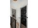 Hallway view of stackable washer and dryer in modern home at 2434 Mapleton Ave, Boulder, CO 80304
