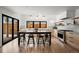 Spacious kitchen with an island and seating, stainless steel appliances, and modern design at 2434 Mapleton Ave, Boulder, CO 80304