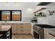 Close-up of a kitchen featuring an island and stainless steel appliances at 2434 Mapleton Ave, Boulder, CO 80304