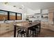 Modern kitchen featuring wood cabinets, marble countertops, an island, and stainless steel appliances at 2434 Mapleton Ave, Boulder, CO 80304