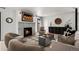 A stylish living room featuring a cozy fireplace, modern decor, and an inviting atmosphere for relaxation and social gatherings at 2434 Mapleton Ave, Boulder, CO 80304