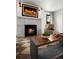 A well lit living room features a cozy fireplace, chic coffee table, and modern decor, creating an inviting atmosphere at 2434 Mapleton Ave, Boulder, CO 80304