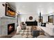 Spacious living room with a fireplace, hardwood floors, and stylish accents, offering a cozy and inviting space at 2434 Mapleton Ave, Boulder, CO 80304