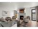 This open living area features a stylish fireplace, modern design elements, and great flow for comfortable living and entertaining at 2434 Mapleton Ave, Boulder, CO 80304