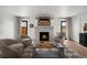 Bright living room featuring hardwood floors, fireplace, and contemporary furnishings, ideal for relaxing or entertaining guests at 2434 Mapleton Ave, Boulder, CO 80304