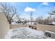 Rooftop deck covered in snow with views of neighborhood homes under a bright blue sky at 2434 Mapleton Ave, Boulder, CO 80304