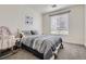 Cozy bedroom with blue accents, a large window, and neutral carpet at 16841 Askins Loop # 105, Parker, CO 80134