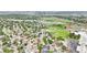 Aerial view showcasing a neighborhood near schools, baseball field, and residential streets at 2393 E 90Th Ave, Thornton, CO 80229