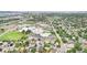 Aerial view showcasing a neighborhood near schools, parks and residential streets at 2393 E 90Th Ave, Thornton, CO 80229