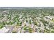 Expansive aerial view of a neighborhood showcasing mature trees, green spaces, and residential streets at 2393 E 90Th Ave, Thornton, CO 80229