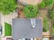 Aerial view of the home showcases the roof, backyard, and surrounding greenery of the neighborhood at 2393 E 90Th Ave, Thornton, CO 80229