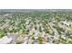 Expansive aerial view of a neighborhood showcasing mature trees, green spaces, and residential streets at 2393 E 90Th Ave, Thornton, CO 80229