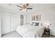 Bedroom features decorative art, ceiling fan and closet with sliding doors at 2393 E 90Th Ave, Thornton, CO 80229
