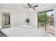 Bedroom features sliding door to the exterior deck and view at 2393 E 90Th Ave, Thornton, CO 80229