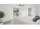 Bright bedroom features sliding door to the exterior deck and view at 2393 E 90Th Ave, Thornton, CO 80229