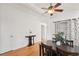 Dining room with hardwood floors and ceiling fan plus stylish table, chairs, and decor at 2393 E 90Th Ave, Thornton, CO 80229