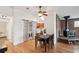 Dining area with hardwood floors conveniently located by a laundry area and modern kitchen at 2393 E 90Th Ave, Thornton, CO 80229