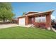 Charming home with lush lawn, flower bushes, and single car garage at 2393 E 90Th Ave, Thornton, CO 80229