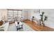 Open-concept living room offers hardwood floors, neutral decor, and an inviting seating area at 2393 E 90Th Ave, Thornton, CO 80229