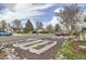 Street view of a home's front yard showing rock landscaping, mulch, white planters, and colorful centerpiece at 1254 S Osceola St, Denver, CO 80219