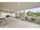Wide covered patio offering views of the landscaped backyard at 1254 S Osceola St, Denver, CO 80219
