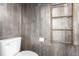 Unique bathroom design featuring rustic wood plank walls and decorative ladder at 18639 E 50Th Pl, Denver, CO 80249