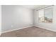 Cozy bedroom with carpet, a large window, and a neutral color palette at 18639 E 50Th Pl, Denver, CO 80249