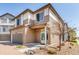 Exterior view showing the home's driveway, landscaping, and neutral color palette at 18639 E 50Th Pl, Denver, CO 80249