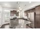 Kitchen with stainless appliances, granite countertops, and white subway tile backsplash at 18639 E 50Th Pl, Denver, CO 80249