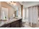 Bathroom with granite vanity and updated fixtures at 3880 Sheridan Blvd, Denver, CO 80212