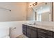 Modern bathroom with granite countertop and subway tile at 3880 Sheridan Blvd, Denver, CO 80212
