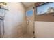Updated bathroom with walk-in shower and window at 3880 Sheridan Blvd, Denver, CO 80212