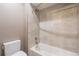 Clean bathroom with a shower/tub combo and toilet at 3880 Sheridan Blvd, Denver, CO 80212