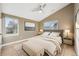 Main bedroom with plush bedding and ample natural light at 3880 Sheridan Blvd, Denver, CO 80212