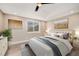 Bright bedroom with a queen-size bed and large windows at 3880 Sheridan Blvd, Denver, CO 80212