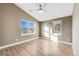 Well-lit bedroom with hardwood floors and ceiling fan at 3880 Sheridan Blvd, Denver, CO 80212