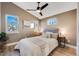 Bright bedroom featuring a comfortable bed and large windows at 3880 Sheridan Blvd, Denver, CO 80212