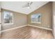 Spacious bedroom with a ceiling fan and hardwood floors at 3880 Sheridan Blvd, Denver, CO 80212