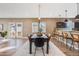 Modern dining area with six chairs and a view of the kitchen at 3880 Sheridan Blvd, Denver, CO 80212