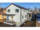 Two-story modern home with gray siding, showcasing a deck and yard at 3880 Sheridan Blvd, Denver, CO 80212