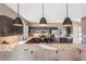 Granite countertops and stainless steel appliances in this modern kitchen at 3880 Sheridan Blvd, Denver, CO 80212