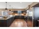 Modern kitchen featuring stainless steel appliances and hardwood floors at 3880 Sheridan Blvd, Denver, CO 80212